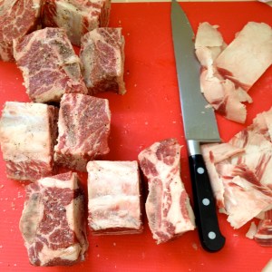 Trim fat off of spare ribs and cut individual portions between bones