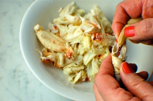 Cracking crab can be easy without tools: have your butcher pre-crack the crab and use the claws to get hard-to-reach pieces of meat. Hand model: mom.